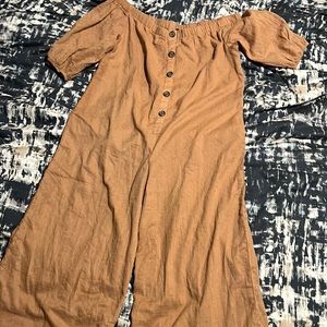 A women’s jumpsuit. Fake buttons